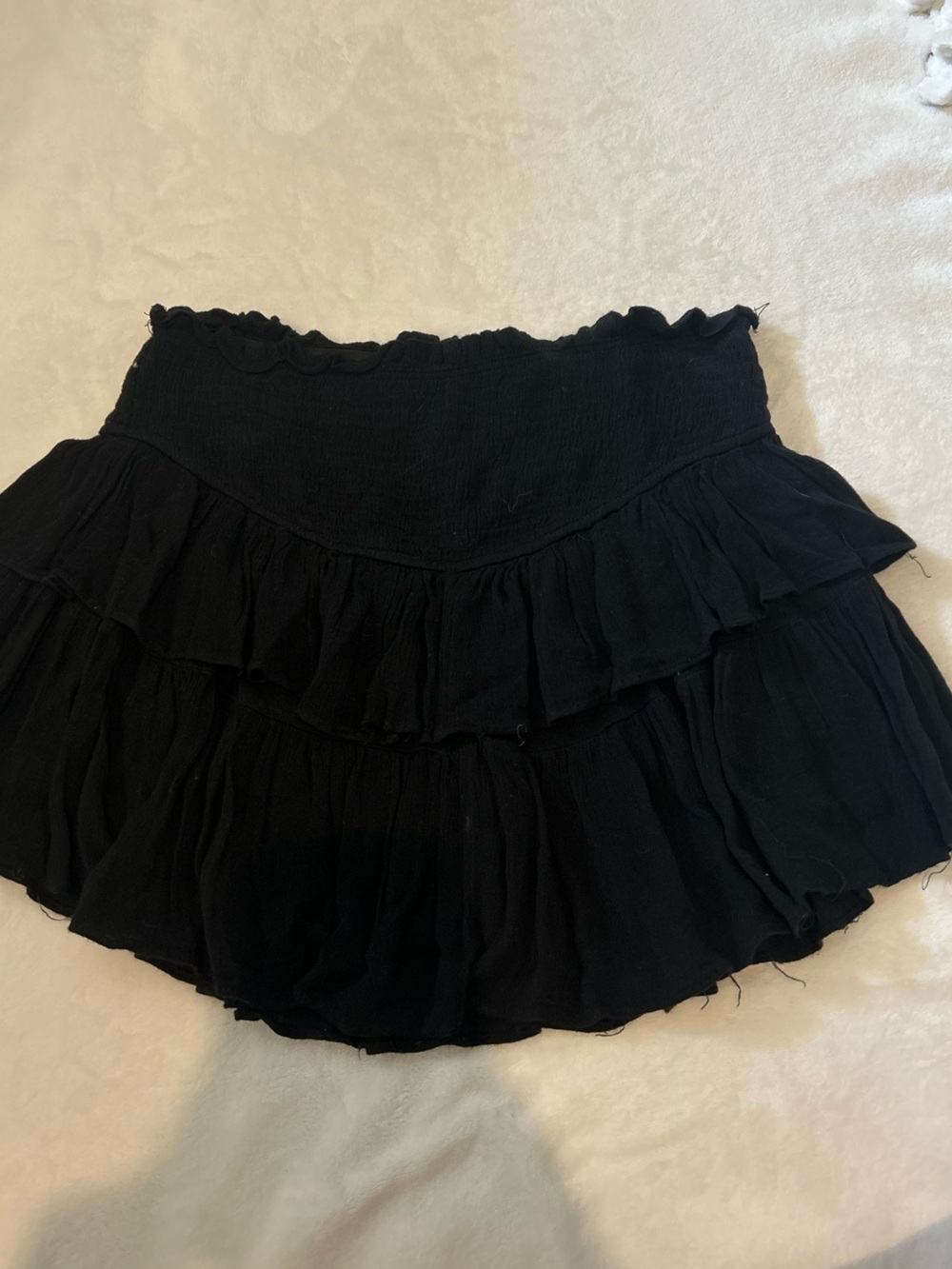 Black ruffled mini skirt